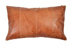 a brown leather pillow on a white background