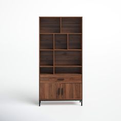 the bookcase is made out of wood and has two doors on one side, with an open drawer at the bottom