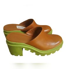 Elevate Your Shoe Game With These Gianni Bini Gb End-Game Leather Mules. These Y2k Style Shoes Have A Closed Toe Design And A Slip-On Closure, Making Them Perfect For Casual Or Travel Occasions. The Brown And Green Is A Beautiful Color Together 1-Inch Platform And Mid-Height Block Heel Give You A Comfortable Lift. Made With Synthetic Lining And Rubber Outsole, These Mules Offer Durability And Long-Lasting Wear. The Size 8m Shoes Are Designed For Women And Have A Medium Width. The Gb End-Game Mod Green Leather Slip-on Heels, Brown Heels With Rubber Sole For Spring, Casual Heels With Lug Sole And Round Toe, Spring Heels With Lug Sole And Round Toe, Casual Closed Toe Heels With Lug Sole, Spring Closed Toe Heels With Lug Sole, Summer Work Heels With Rubber Sole, Summer Workwear Heels With Rubber Sole, Casual Heels With Lug Sole, Medium Width