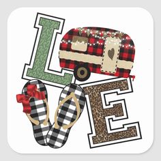 a pair of flip flops sitting next to a camper with the word love on it