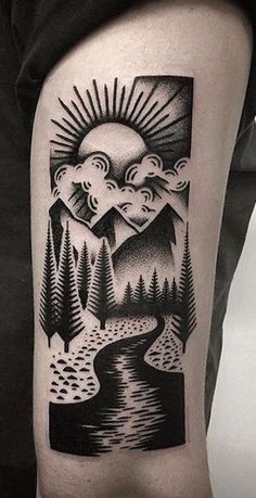 a man's arm with a black and white landscape tattoo on the left thigh