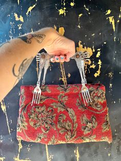 "Fantastic vintage mid century red tone and taupe baroque design tapestry top handle hand bag. Handles are made out of antique silver tone forks!  Each handle is made out of three forks, bolted together. Thicker tapestry fabric, resembling a rug. Feel is velvety soft. It fits more than you think it will (can fit a book) and is quite sturdy. This is a one of a kind, truly special hand bag! I am already jealous of the future owner; this item is at risk of me keeping. Great vintage condition. length across bottom 14.5\" length across top 11.5\" height 8.5\"" Ornate Rug, Carpet Bag Purse, Tapestry Purse, Red Tone, Baroque Design, Tapestry Bag, Carpet Bag, Tapestry Fabric, Rug Bag