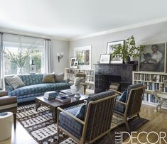 a living room filled with furniture and a fire place