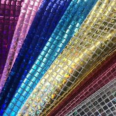 many different colors of sequinized fabric