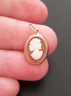 Gorgeous Cameo Pendant in 18 Carats Solid Yellow Gold, Gold 750, hallmarked. It is from the 90's and it's in perfect condition. The sculpted female bust centre piece is surrounded with the 18K Gold Frame with beautiful embossed handmade details. Will be sent in our Jewellery box with Polishing Cloth and Certificate of Authenticity. Only this One Available  Don't miss the oportunity if you like these kind of vintage jewellery. 😊 📌 The price is only for the Pendant and does not include a Necklac Female Bust, Vintage Cameo, Centre Piece, Cameo Necklace, Cameo Pendant, Centre Pieces, Vintage Jewellery, Gold Gold, Solid Yellow