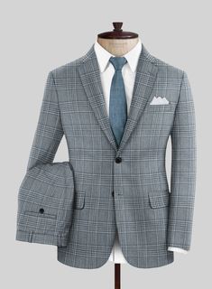 Let the charm of a genuine gentleman take center stage as you flaunt the regal allure of our Loro Piana Benicio Wool Silk Linen Suit. Skillfully crafted from an exquisite blend of wool, silk, and linen, this suit features an elegant plaid pattern in sophisticated dark blue and pristine white tones that effortlessly command attention. Its plush fabric ensures both style and warmth, making it a perfect choice for any occasion. Seamlessly harmonizing with your personal style, whether for formal gat Italian Suit, Silk Linen, Linen Suit, Formal Suits, Plush Fabric, Loro Piana, Wool Suit, Center Stage, Jacket Buttons