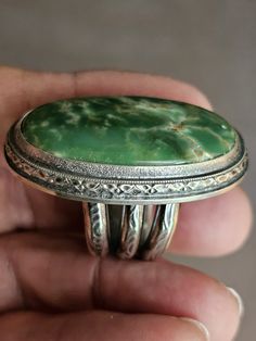 This is a lovely Natural Australian Variscite, green in color oval in shape.  Measuring 35mm x 20mm. The shank is 11mm wide at the bottom (palm side). It is made with Sterling and Fine Silver.  Substantial and all handmade and unique! Filled with heart&soul! Size: 7.25 Please contact me with any questions.  Thank you for visiting QuintessentialSilver! Susan Green Oval Natural Stone Jewelry, Green Oval Gemstone Jewelry, Oval Green Natural Stone Jewelry, Oval Green Jewelry With Polished Finish, Green Oval Turquoise Artisan Ring, Untreated Green Oval Rings, Green Oval Turquoise Gemstone Ring, Green Oval Jewelry With Large Stone, Green Oval Ring With Large Stone