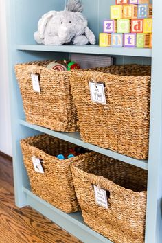 the shelves are filled with baskets and toys