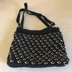 Unusual And Very Well Made Purse Which Is Made From Soda Can Pull Tabs That Are Crocheted Into The Body Of The Bag. Looks As If It Was Never Used. Measures Approximately 12 Inches Wide, 9 1/2 Inches Tall And 3 Inches Deep. The Straps Are 22 Inches Long. The Lining Is A Thinner Fabric And Wouldn’t Hold Up To Heavy Use. The Zipper Works Great! Silver Handmade Bag For Everyday Use, Handmade Silver Bag For Everyday Use, Handmade Silver Bags For Everyday Use, Silver Handmade Shoulder Bag For Everyday Use, Handmade Silver Shoulder Bag For Everyday Use, Silver Handmade Shoulder Bag, Crocheted Purse, Diy Crochet Projects, Hold Ups