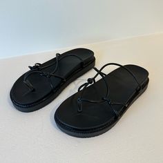 Black Geometric Strappy Platform Sandals. Brand New And Never Worn. Final Sale Black Flat Heel Flip Flops For Beach, Black Flat Heel Beach Sandals, Black Flat Heel Sandals For Beach, Black Flat Sandals For Beach, Black Flat Sandals For The Beach, Black Summer Sandals For The Beach, Black Summer Sandals For Beach, Black Flip Flops For Beach, Black Toe Post Sandals For Beach