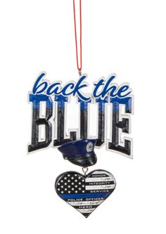 back the blue ornament with an american flag and police badge hanging from a red string