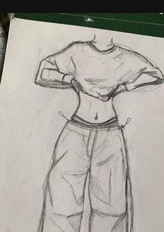 a drawing of a woman's shirt and pants with her hands on her hips