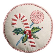 an embroidered christmas decoration with candy canes and holly