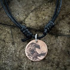 This copper necklace is a reinterpretation of the famous painting The Great Wave off Kanagawa by Hokusai. We have engraved this design into a hammered copper penny (or the larger english half penny copper coin) to make a rippled effect. The half penny is about the size of an American quarter. It's so beautiful! We engraved deeply into the metal so it will last forever. If you would like to have some engraving added to this design (for an extra charge) or something new all together then please me Symbolic Engraved Copper Jewelry, Adjustable Engraved Rose Gold Necklace, Adjustable Etched Bronze Jewelry, Artistic Engraved Bronze Jewelry, Artistic Etched Jewelry For Gifts, Symbolic Bronze Etched Necklace, Symbolic Etched Adjustable Necklace, Symbolic Adjustable Etched Necklace, Symbolic Adjustable Etched Necklaces