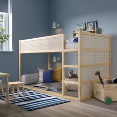 a child's bedroom with bunk beds and toys