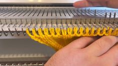 a person is cleaning the inside of an oven with yellow sponges and a brush