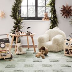 a child's room decorated for christmas with toys and decorations