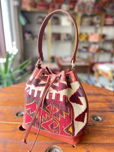 a purse sitting on top of a wooden table