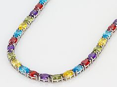 Bella Luce ® multicolor gemstone simulants 52.05ctw oval, rhodium over sterling silver necklace. Measures approximately 18"L x 0.13"W and has a hidden box closure. Fine Jewelry Multicolor Oval Necklace, Fine Jewelry Multicolor Oval Gemstones, Multicolor Multi-stone Oval Necklaces, Oval Multicolor Multi-stone Necklaces, Multicolor Multi-stone Oval Necklace, Multicolor Oval Multi-stone Necklace, Oval Multicolor Jewelry For Formal Occasions, Multicolor Oval Stone Jewelry, Oval Multicolor Gemstones With Accents