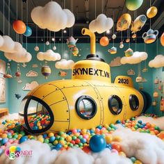 a yellow submarine floating in the air surrounded by clouds and balls with balloons hanging from it's ceiling