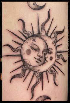 a sun and moon tattoo on the arm