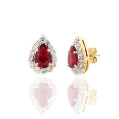 This is part of Chairish’s Fine Jewelry assortment.  Pear Cut Ruby Diamond Halo Studs in 18K Gold. Embrace your look with these stunning pair of earrings suitable for any occasion to complete your outfit. Studs create a subtle beauty while showcasing the colors of the natural precious gemstones and illuminating diamonds making a statement.  PRODUCT DETAILS :-  Material - 18K Solid Yellow Gold Gemstone - Ruby  Gemstone shape - Pear   Gemstone Weight - 1.3 ct Gemstone Size - 6 x 5 mm  Diamond Weight - 0.45 ct  Diamond Size - 1.5 mm  Gross Weight - 3.74 Grm Setting - Prong setting Yellow Gold Ruby Earrings With Diamond Accents, Ruby Yellow Gold Earrings For Celebration, Elegant Ruby Earrings In Yellow Gold, Elegant Ruby Earrings With Diamond Accents, Formal Ruby Earrings In Yellow Gold, Elegant Yellow Gold Ruby Earrings, Formal Yellow Gold Ruby Earrings, Formal Ruby Yellow Gold Earrings, Ruby Yellow Gold Wedding Earrings