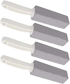 four white and gray spatulas with plastic handles