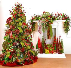 a decorated christmas tree sitting next to a fireplace