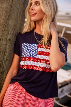 Stand out from the crowd with this flower flag tee! This navy tee is accented... Queen Summer, Skirt Shapewear, Rodeo Queen, Navy Flowers, Fall Kids, Romper Pants, Cover Up Dress, Sweater Blouse, Clothes Collection