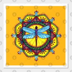 a blue dragonfly sitting on top of a yellow and red circular object with ornate designs