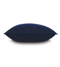 a blue pillow sitting on top of a white floor