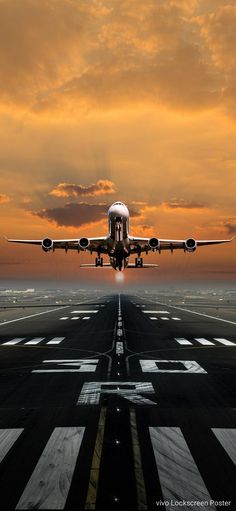 an airplane is taking off from the runway at sunset or dawn, with clouds in the background