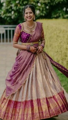 A Kanjivaram half saree is a beautiful and traditional outfit often worn in South Indian weddings and festivities. It typically features a blouse, a skirt (lehenga or pavadai), and a dupatta (odhani) Half Saree Ideas, Bridal Half Saree, Reception Dress Indian, Skirt Lehenga, Haldi Outfits, Saree Ideas