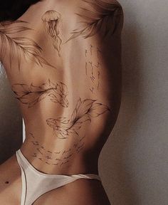 the back of a woman's body with birds drawn on her side and arrows pointing up