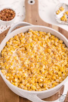 a casserole dish filled with corn and cheese