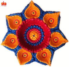 an orange, blue and red decorative object on a white background