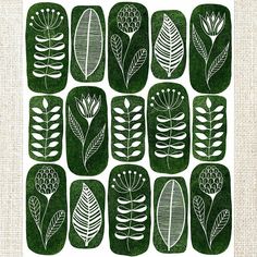 a green and white print with leaves on it