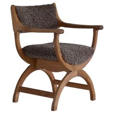 a wooden chair with grey upholstered fabric on the seat and armrests