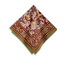 a red and green bandana with an intricate design on it's side,