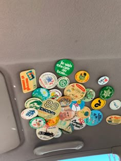 a bunch of different colored and shaped buttons on a car's dash board or dashboard