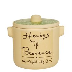 a ceramic pot with the words herbs of proven written in cursive writing on it