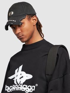 Adjustable strap at back. Front and visor stitched logo details. Intentionally distressed and stained areas may vary Balenciaga Cap, Balenciaga Men, Black Men, Balenciaga, Adjustable Straps, Top Brands, Luxury Fashion, ? Logo, Hats