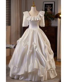 Buy beaded ruffled square neckline satin ballgown wedding dress with lace at wholesale price online. Free shipping and pro custom service since 2009. Formal Satin Ball Gown With Ruffles, Satin Ball Gown With Ruffles For Wedding, Satin Ball Gown With Ruffles, Satin Gown With Ruffles And Fitted Bodice, Satin Ruffle Ball Gown, Satin Victorian Ball Gown For Wedding, Ruffled Wedding Dress With Fitted Bodice For Debutante Ball, Victorian Satin Dress With Ruffles For Wedding, Satin Wedding Gown With Ruffles