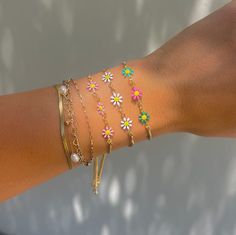 These daisy chains are the most adorable new addition to our sliding adjustable bracelets. Available in four different colors, you will love these colorful bracelets! Adjustable to any wrist size. 14k gold plated over copper Trendy Multicolor Adjustable Jewelry, Resizable Jewelry As A Spring Gift, Trendy Resizable Jewelry For Spring, Resizable Jewelry Gift For Spring, Trendy 14k Gold Filled Bracelet With Adjustable Chain, Resizable Adjustable Jewelry For Spring, Resizable Bracelets For Spring, Adjustable Daisy Everyday Jewelry, Trendy Adjustable Multicolor Chain Bracelet