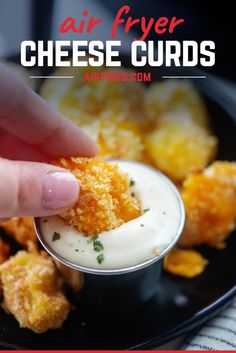 a hand dipping cheese into a small bowl with ranch dressing on it and the words air fryer cheese curls in the background