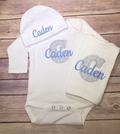 "How adorable is this Newborn Baby Boy Outfit? It's perfect for a baby shower gift or coming home from the hospital outfit! A personalized baby outfit is always something the proud parents will cherish! The COMPLETE SET include a gown or bodysuit, beanie hat, bib, and burp cloth. All items are high quality interlock knit and available in sizes 0-3 and 3-6 month. The 0-3 month will fit a newborn. This Baby Boy Clothing set can be embroidered with his Name or Monogram with any color thread. An ini Customizable Cotton Sets For Baptism, Customizable Fitted Sets For Baptism, Personalized Fitted White Sets, Personalized Fitted White Set, White Fitted Set As Gift, Baby Monogram Ideas, Hospital Newborn, Baby Boy Coming Home Outfit, Personalized Baby Hat