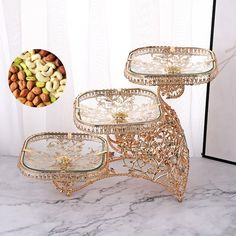 three glass trays sitting on top of a marble counter