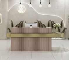 the front desk of an office is decorated with gold accents and white walls, along with potted plants