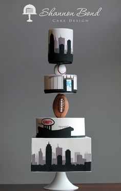 three tiered cake decorated with footballs and other sports related items in the city