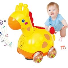 a baby sitting on the ground next to a toy giraffe and musical notes